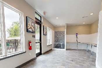 A room with a fire extinguisher on the wall.