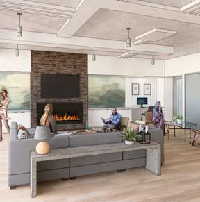 A group of people are sitting around a fireplace in a modern living room.
