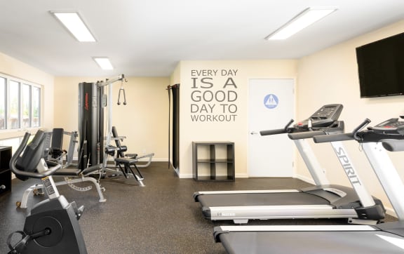 a gym with rows of treadmills and other exercise equipment  at Pleasanton Heights, Pleasanton, CA, 94566
