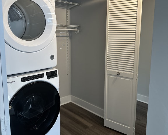 a washer and dryer in a laundry room with a closet