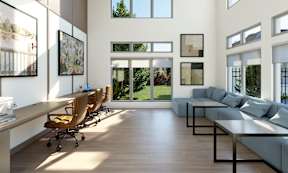 A modern living room with a long wooden table and chairs.