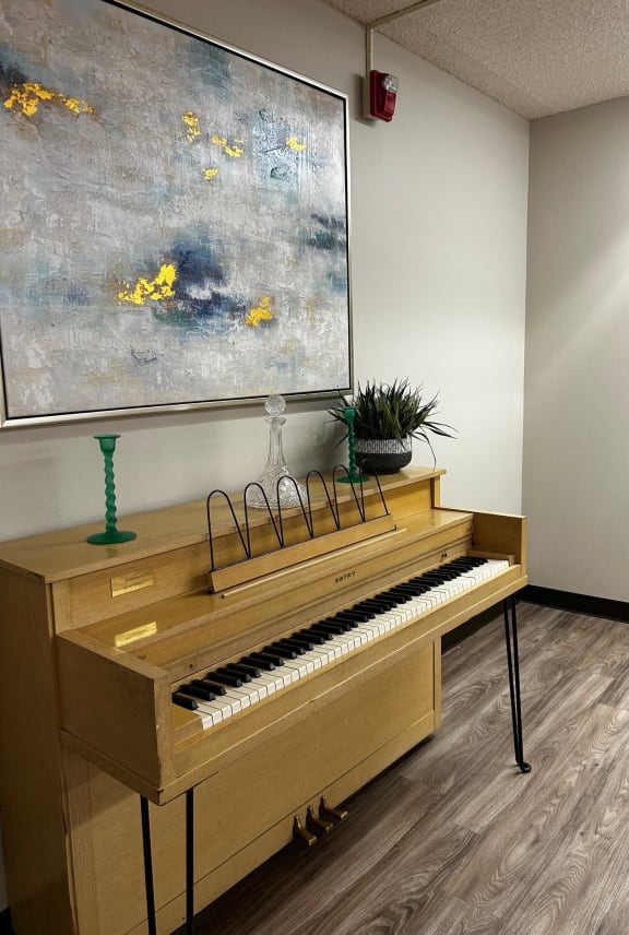 a view of a piano from the top of the stairs