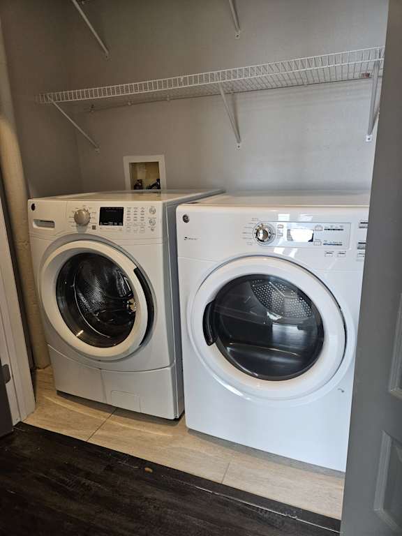 A washing machine is installed in a small room.