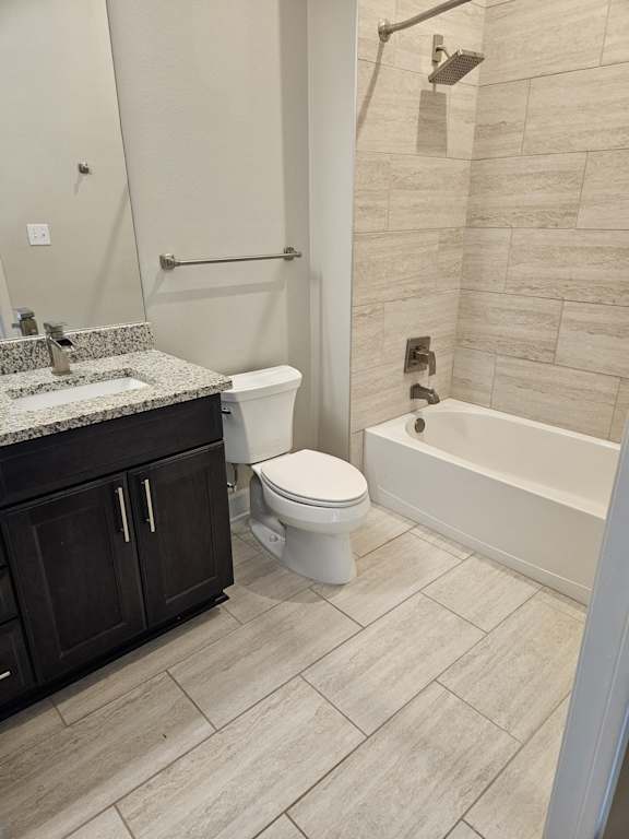 A bathroom with a toilet, sink, and shower.