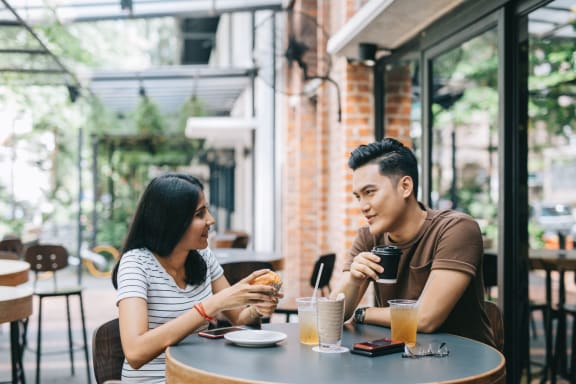 a couple enjoying coffee and lunch outside at Capriana at Chino Hills, Chino Hills, CA, 91709