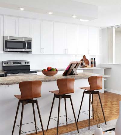 Staged suite, looking back at the kitchen from the living room.