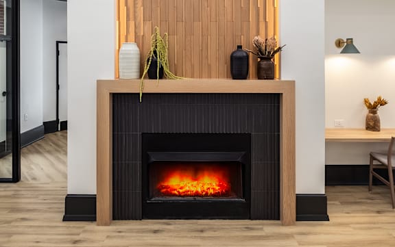 a fireplace with a woodeneworkework above it in a living room