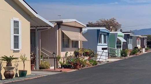 A row of houses with a street in between.