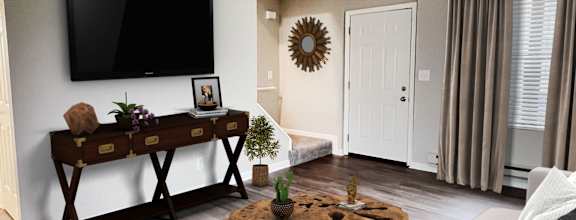 a living room with a couch and a table 