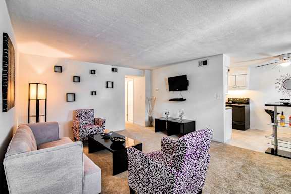 A room with a fireplace and a door leading outside.