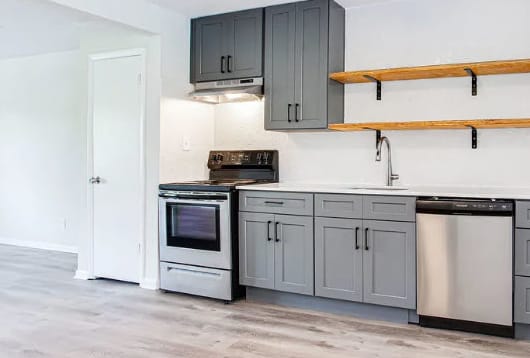 a kitchen with gray cabinets and white walls  at The Oasis on Cascade, Atlanta, GA, 30310