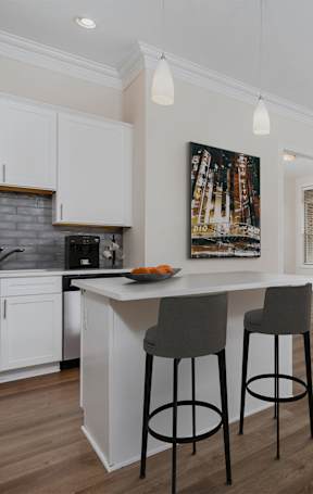 a kitchen and dining area in a 555 waverly unit