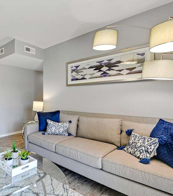 photo of a bright living room with staged furniture and modern finishes
