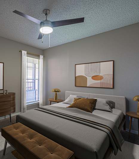 a living room with leather furniture and a ceiling fan  at Paces Crossing, Texas