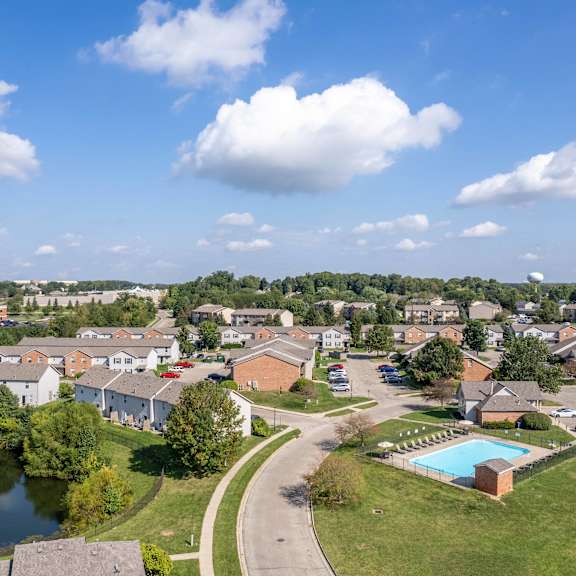 A residential area with houses and a swimming pool.