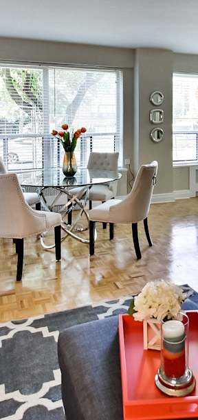 a living room with a couch and a table with chairs