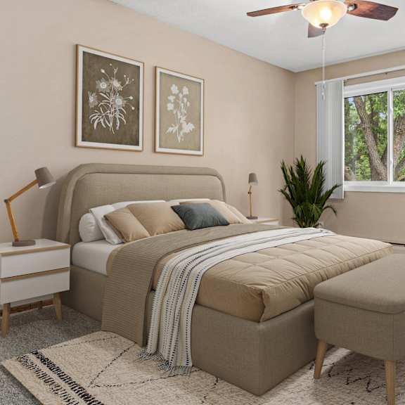 A bedroom with a bed, a bench, and a window.