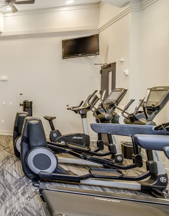 the gym at the enclave at woodbridge apartments in sugar land, tx