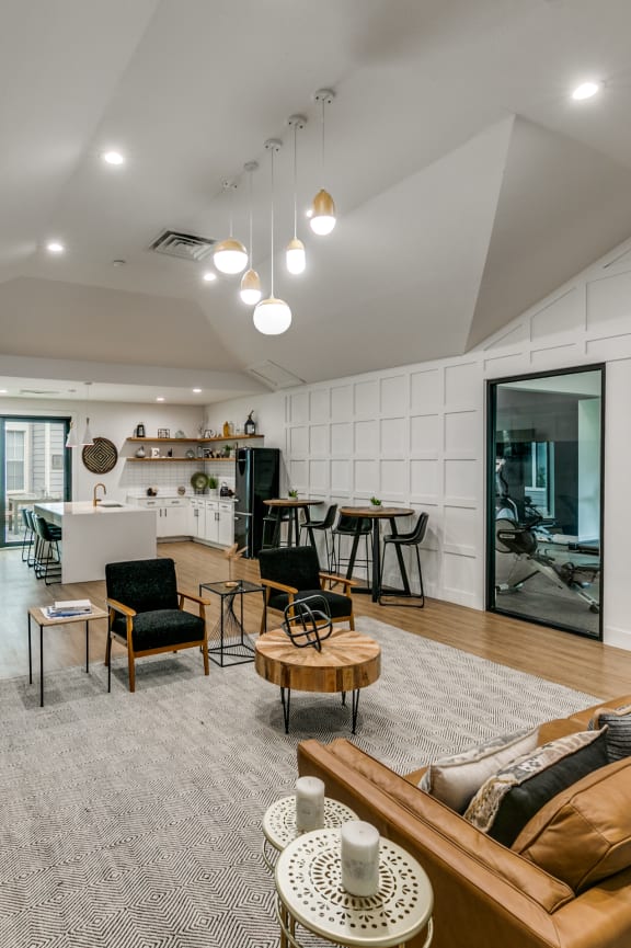 a kitchen with wooden cabinets and a black microwave