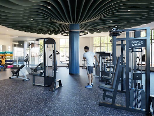 A gym with a person working out.