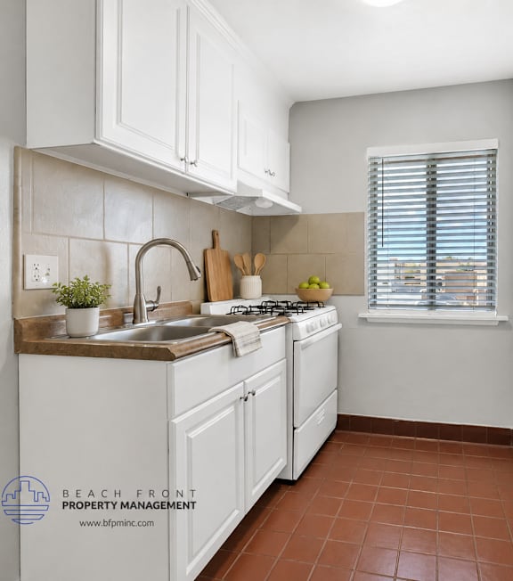 A well-lit, modern kitchen and living room with a dining area.