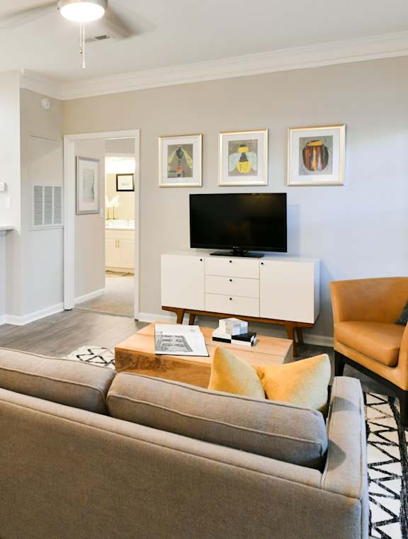 the living room has a large window and a coffered ceiling at The Ridge at Chenal Valley, Little Rock, Arkansas