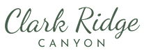 A logo with a mountain and the words "Clark Ridge Canyon" written in cursive.