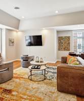 a sofa with white cushions in a living room