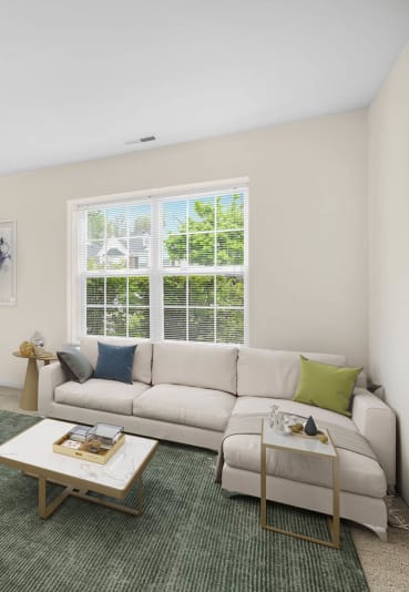 a living room with a couch and a table at Wyndchase, Canton, MI 48147
