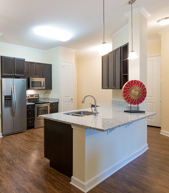 a kitchen and dining area at Alaqua Apartments, Florida, 32258