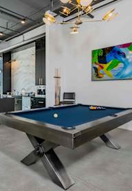 Pool table with art in the background