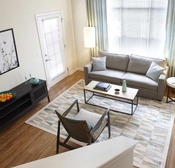 An interior picture showing the view from the kitchen through to the living area of a loft unit