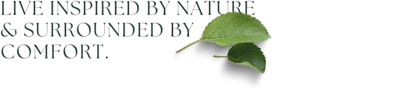 A green leaf with the text "Live inspired by nature & surrounded by comfort."