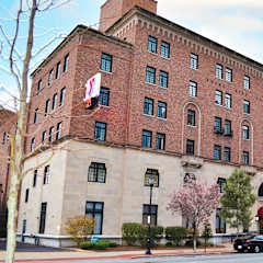 a large brick building on the corner of a city street