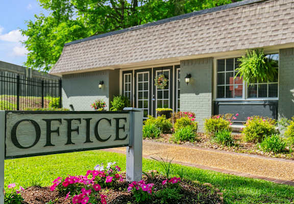 A small building with a sign that says "OFFICE" in front of it.