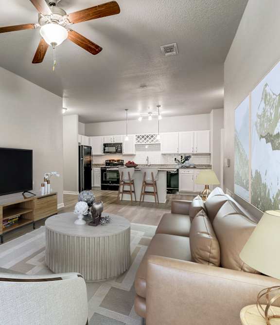 A living room with a television, a couch, a chair, a table, and a plant.