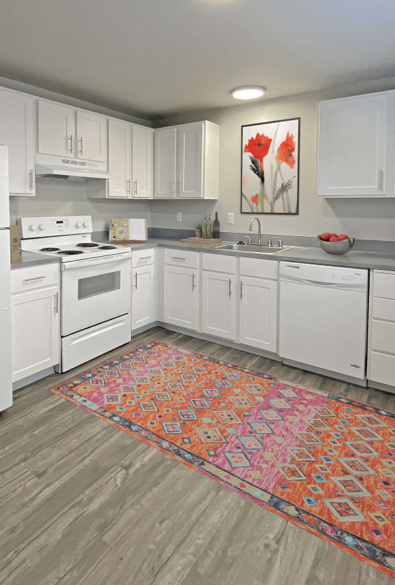 Spacious l-shaped kitchen, natural light, white appliances, top and bottom cabinet storage.at Quilceda Gardens, Marysville, 98270