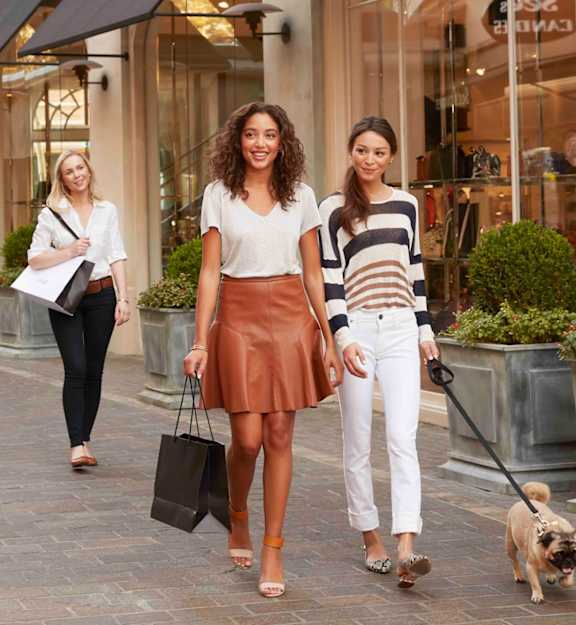 a group of people walking down a street