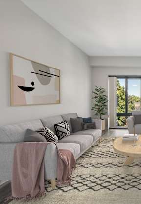 a room with a large table and chairs with a coffee machine in the background at Residences at Manchester Place, Manchester, 03101