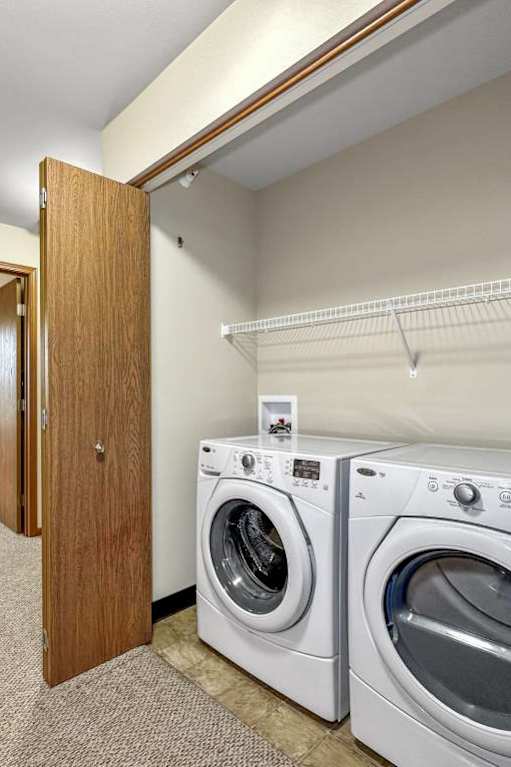 A laundry room with a washer and dryer.at Cornerstone Commons, Iowa, 50131