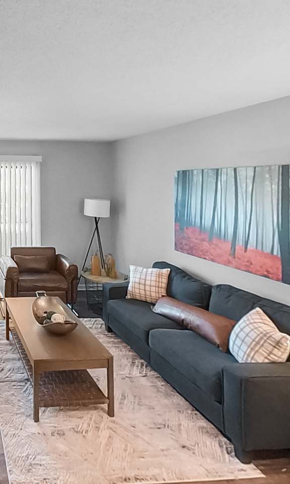 a living room with a couch and a table