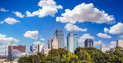 the skyline of the city with clouds in the sky