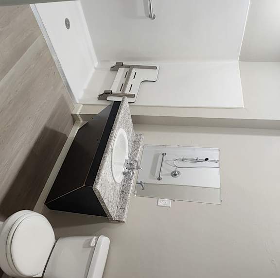 A bathroom with a toilet and a sink.