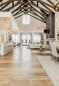 a large living room with a dining room and a kitchen