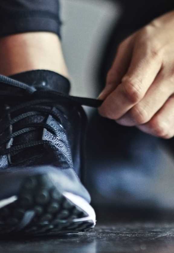 Tying Up Running Shoes at The Monterey Apartments in San Jose, CA