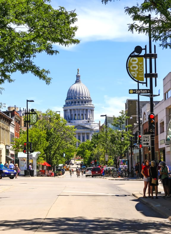 a city street with a large dome in the background at Preserve West, Madison, WI, 53711