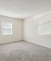a bedroom with a bed and pillows