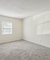 a bedroom with a bed and pillows