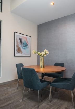 a dining room with a large window and a vase of flowers on the table at Monterey Ranch, Austin, 78749