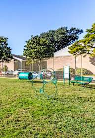a backyard with a swimming pool and a barbecue grill